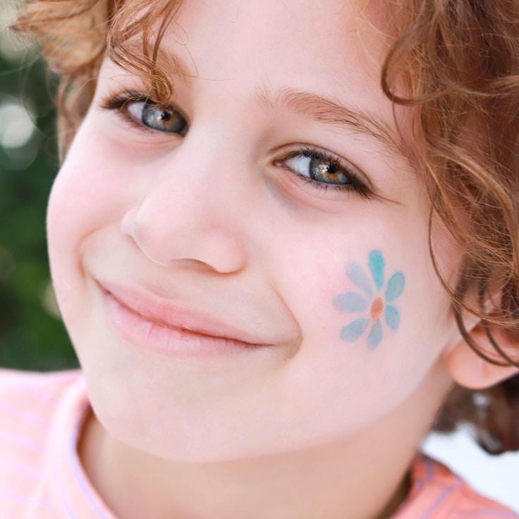 Kaveri Mehta, Lead Design Curator at Grove Paper Studio, reviewing corporate floral arrangements
